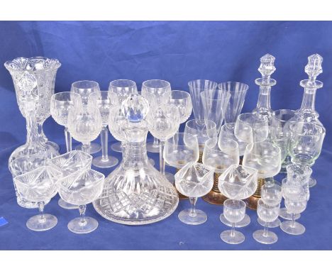 A collection of table glasswareTo include a pair of bottle shaped decanters, facet cut wine glasses and fern etched celery va