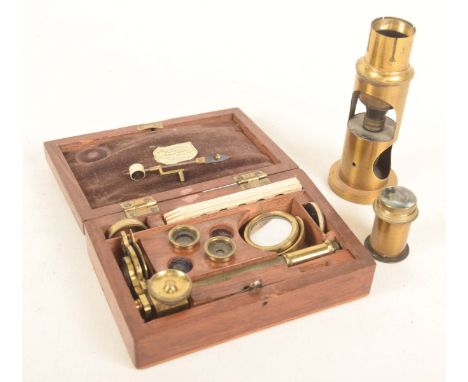 A late 19th early 20th Century cased miniature/pocket microscopeWithin a fitted mahogany case complete with assorted miniatur