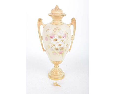 A Royal Worcester blush ivory vaseComplete with cover, although finial detached, of tapering form and painted with sprays of 