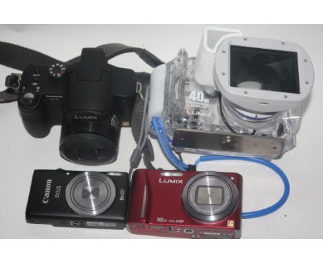 Lumix DMC -F27 together with a Lumix DMW-MCT 220, a Hitachi camcorder, a Fujifilim F10 and a Canon Ixus 132