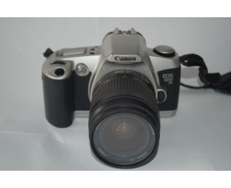 Canon EOS 500N film camera with manual and case together with Canon zoom lens EF28-80mm