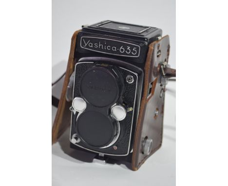 Yashica-635 35mm film camera together with manual, slide, copier, Prinzflex 3 x autoconverter and magic automatic bellows P m