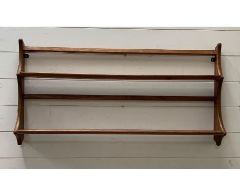 A wall hanging Ercol shelving unit 