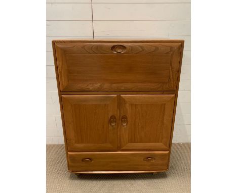 An Ercol bureau (H110cm W82cm D44cm)