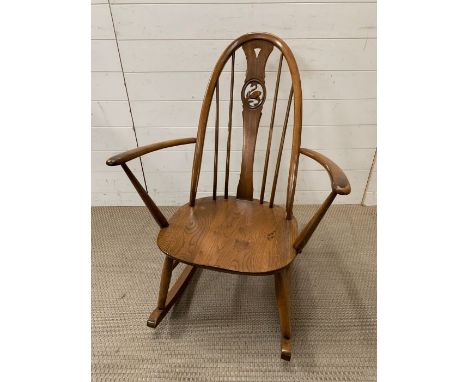 An Ercol rocking spindle back chair 