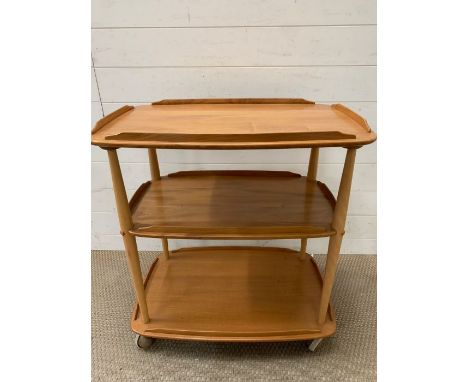 A three tier blonde Ercol trolley (H78cm W70cm)