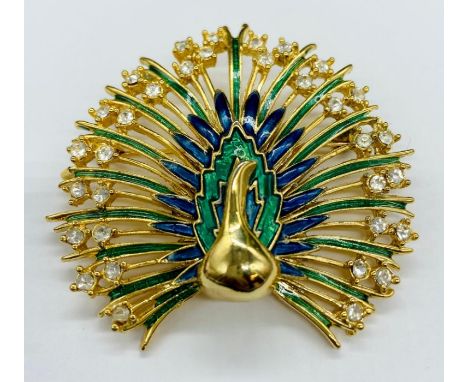 A enamel and diamante peacock brooch