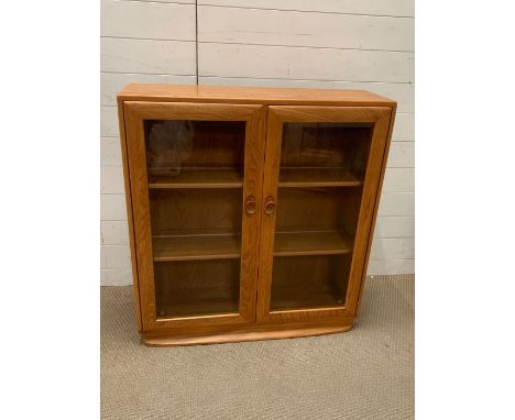 Am Ercol glazed to door cabinet (H100cm W92cm D28cm)