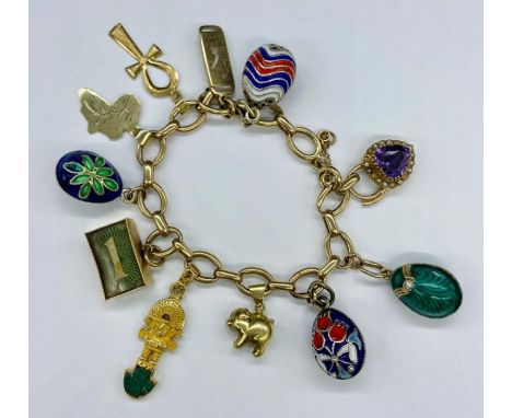 A 9ct gold charm bracelet with a range of charms including four enamel eggs and various hallmarked charms (Total Weight 54.4g