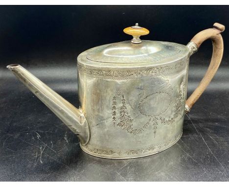 A Silver teapot by George Smith (IV) Hallmarked for London 1790, engraved with wooden handle and finial (Total Weight 486g)