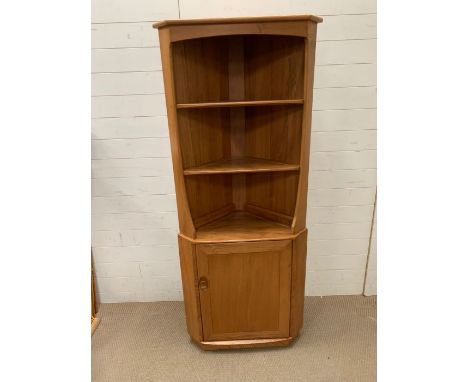 An Ercol corner display unit (H180cm W77cm D47cm)