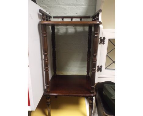 A 2 tier oak lamp table with galleried top
