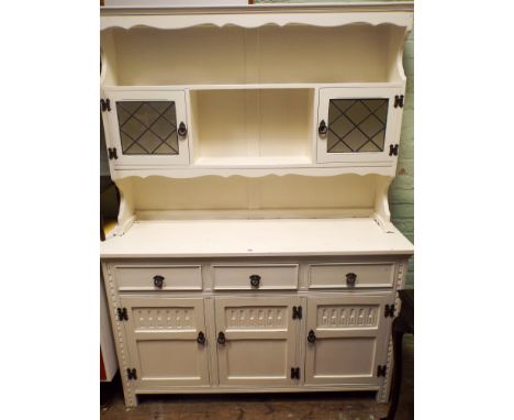 A 4'6 white painted oak kitchen dresser with shelf back and lead light cabinets standing on drawer and cupboard base 