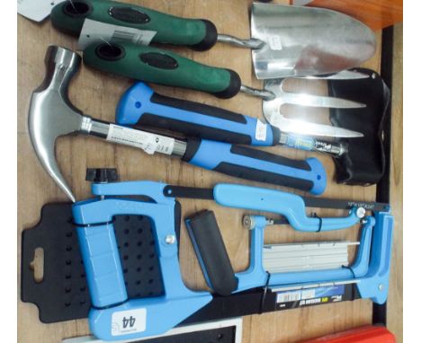 Four-piece hacksaw set, new claw hammer, new axe, and a new stainless steel hand trowel and fork