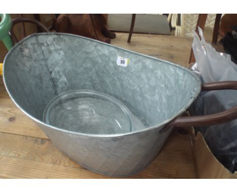 A smaller oval galvanized planter