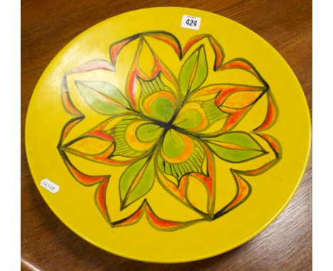 A Poole Pottery Delphis charger decorated in yellow and green 
