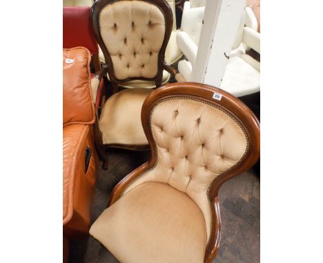 A pair of ladies and gent's Victorian mahogany framed button backed chairs in fawn covering 