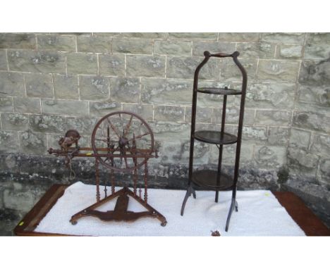 &nbsp;(43) A small antique spinning wheel with bobbin turned supports raised on a triangular base, height 23ins, together wit