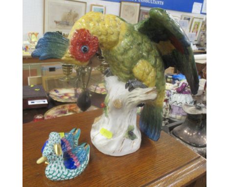 A Dresden porcelain model of a parrot, together with a Herand model of two ducks