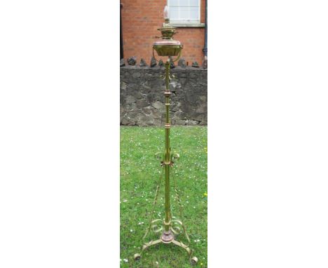 A brass and copper oil lamp standard lamp, converted to electricity, height 61ins