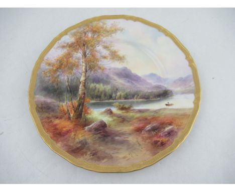 A Royal Worcester plate decorated with a view of Derwent Water by Harry Davies to a gilt boarder diameter 10.75insCondition R