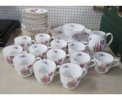 A Spode tea set, twelve setting, decorated with flowers