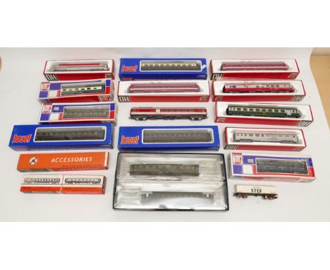 A collection of Jouef and Playcraft 00 gauge model railway carriages, goods wagons, rolling stock and accessories, together a