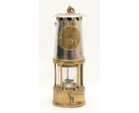 A brass Eccles miners lamp, type 6, with applied makers plaque stamped 080, 25cm tall.