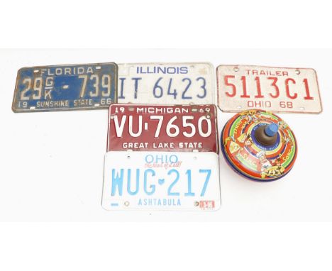 A selection of five pressed metal U.S.A vehicle number plates, circa 20th century, states to include Michigan, Florida, Ohio,