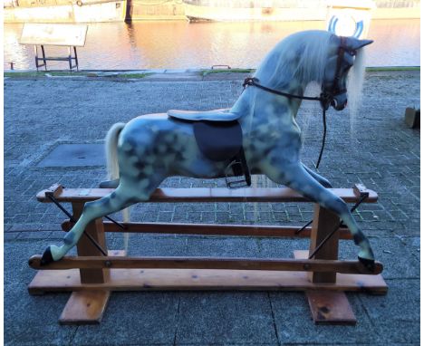 A mid 20th century 'Haddon Rockers' cantilever rocking horse, dapple painted fibreglass, with horse hair mane and tail, leath