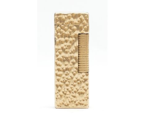 Alfred Dunhill; A Dunhill rollagas gold plated pocket cigarette lighter.