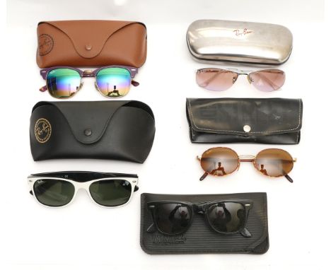 Five pairs of Ray-Ban sunglasses, to include, a pair of Wayfarers, no visible serial no, cased, a pair of silver frames, seri