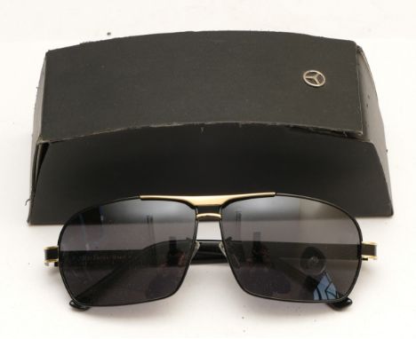 A pair of Mercedes Benz branded sunglasses, serial no. MB722 65 12-142, complete with case.