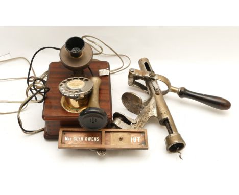 Centenary of the telephone 1876-1976; A reproduction wall mounted brass telephone, together with a solid brass bar top cork s