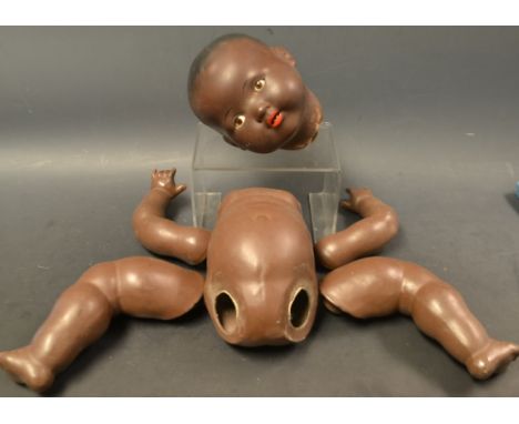 An Armand Marseille black bisque headed doll, composition body Condition Report: Needs re stringing