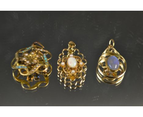 A 9ct gold pendant set with a central opal and seed pearls; another, with central fire opal, unmarked; a 9ct pendant set with