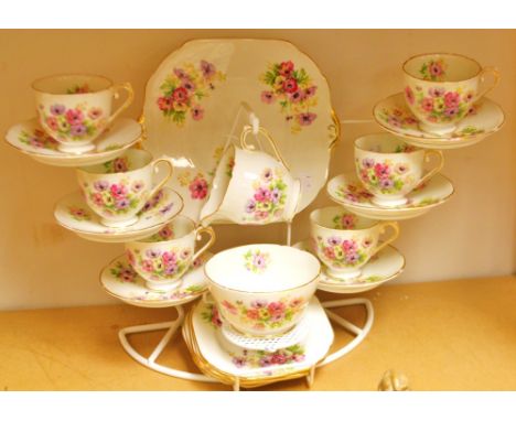 A Stanley China tea set, printed with colourful summer flowers comprising six tea cups, saucers and tea plates, milk, sugar a