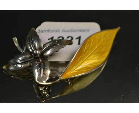 Jewellery - a David Andersen Norwegian yellow enamel and silver leaf brooch, another, NE Danish silver flower brooch (2)