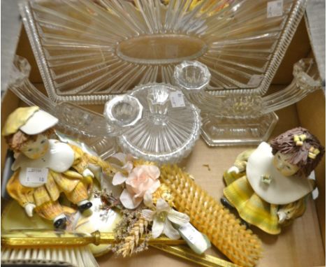 An Art Deco pressed glass dressing table tray, with a pair of two-branch candlesticks and circular covered powder bowl;  a pa