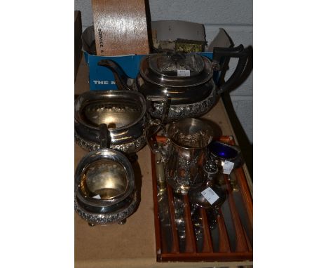 A 19th century EPNS three piece boat shaped tea service; a James Dixon & Sons embossed EPNS mug; Flatware; crumb tray; carvin