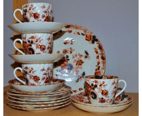 A part Edwardian tea service, printed in the Imari palette, comprising dinner plate, six side plates, four teacups, and five 