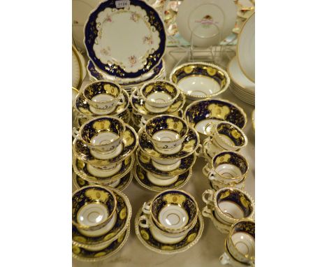 Tableware- a H & R Daniel tea service decorated with cream and yellow panels upon Colbolt Blue and gilt ground including two 