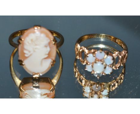 A 9ct gold opal seven stone floral cluster ring, open shoulders; a cameo ring, 9ct shank (2)