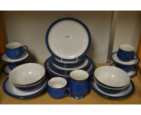 A Denby pottery table service, comprising four dinner plates, four bowls, four cups and saucers, four side plates; etc.