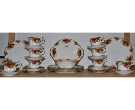A Royal Albert Old Country Roses part dinner service including six dinner plates, seven cup and saucers, bread and butter pla