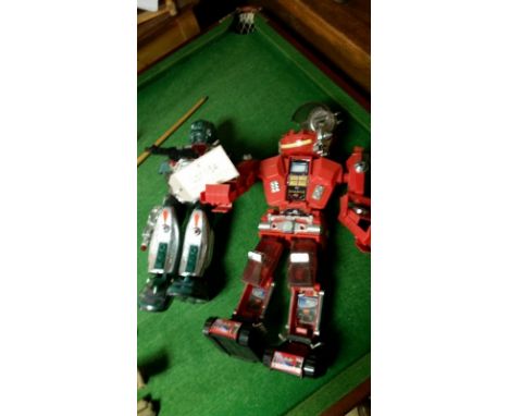 Two vintage robot toys, red (c. 50cm) and green (c. 43 cm)