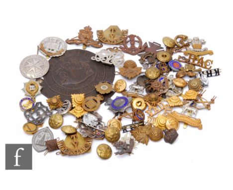 A collection of military and other badges to include example for the World War One 12 Voluntary Aid Detachment Worcester, a W