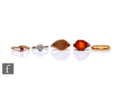 Four 9ct rings to include a signet and a single stones amethyst, total weight 14g, with a 22ct wedding ring, weight 3.3g, var