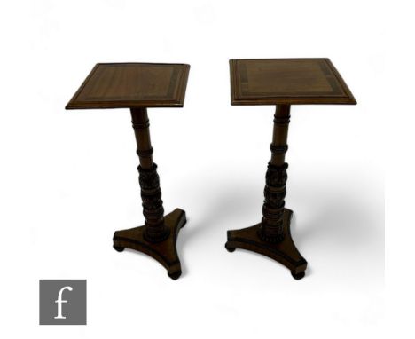 A pair of 19th Century rosewood crossbanded mahogany torchere stands in the Gillows style, the moulded edge and banded square