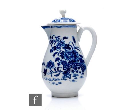 An 18th Century first period Worcester sparrow beak jug circa 1770, of footed ovoid form with loop handle and matched domed c